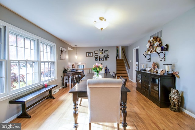 dining room featuring light hardwood / wood-style floors and plenty of natural light