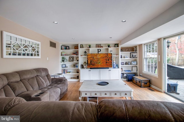 living room with light hardwood / wood-style floors