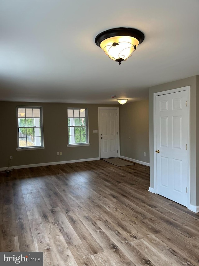 interior space with hardwood / wood-style flooring and a healthy amount of sunlight