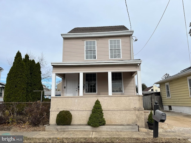 view of property featuring covered porch