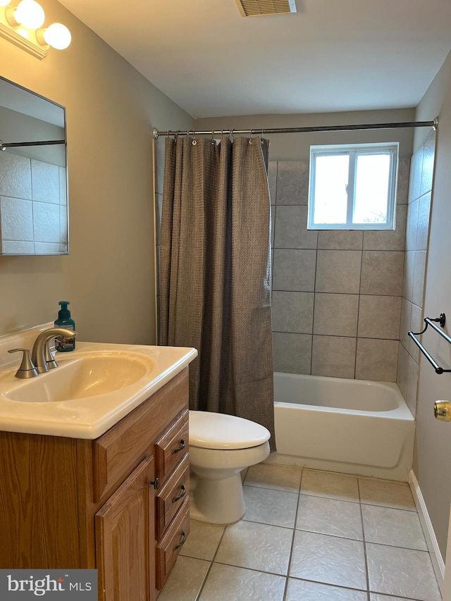 full bathroom featuring tile patterned flooring, vanity, shower / bath combination with curtain, and toilet