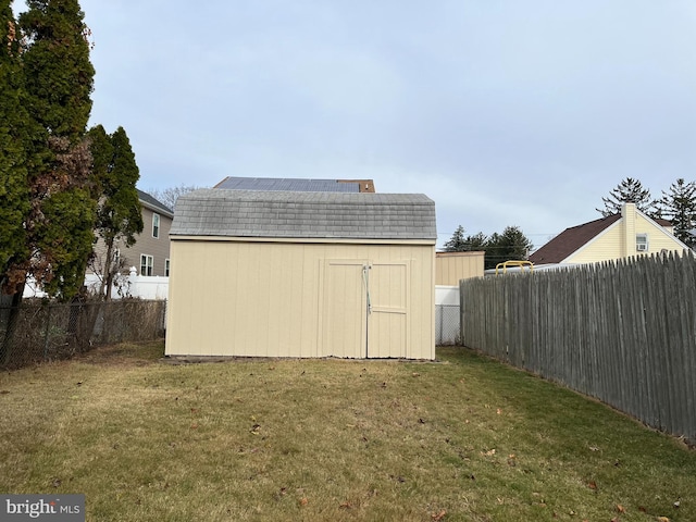 view of outbuilding featuring a lawn