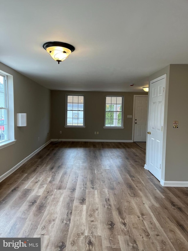 empty room with wood-type flooring