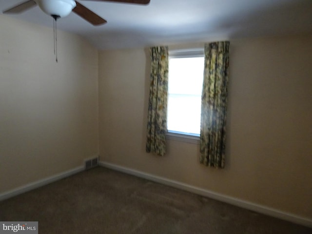 carpeted empty room with ceiling fan