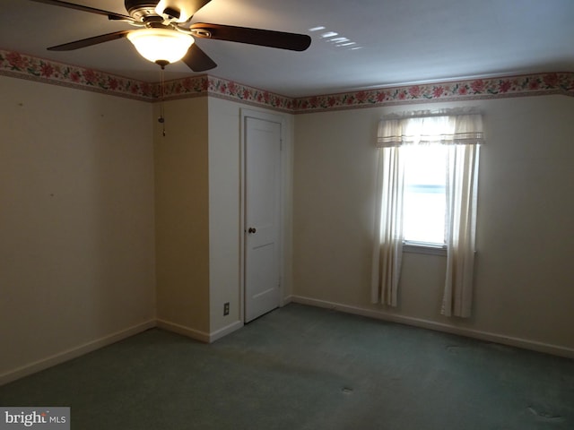 carpeted empty room with ceiling fan