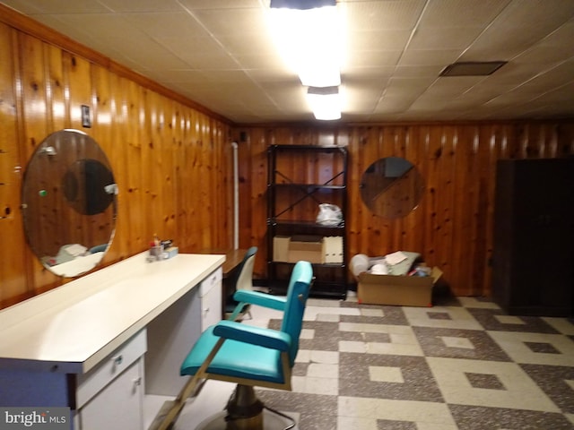 office space featuring wood walls