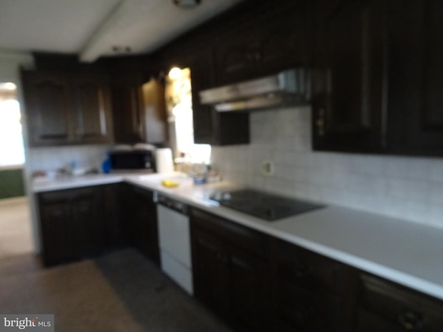 kitchen featuring backsplash, dark brown cabinets, white dishwasher, and black stovetop