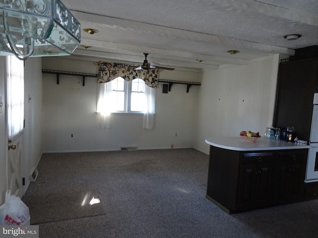 interior space with carpet, ceiling fan, and double oven