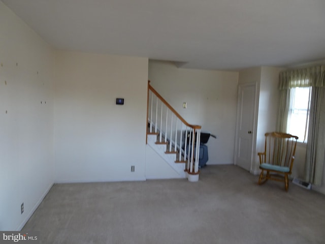 spare room featuring carpet flooring