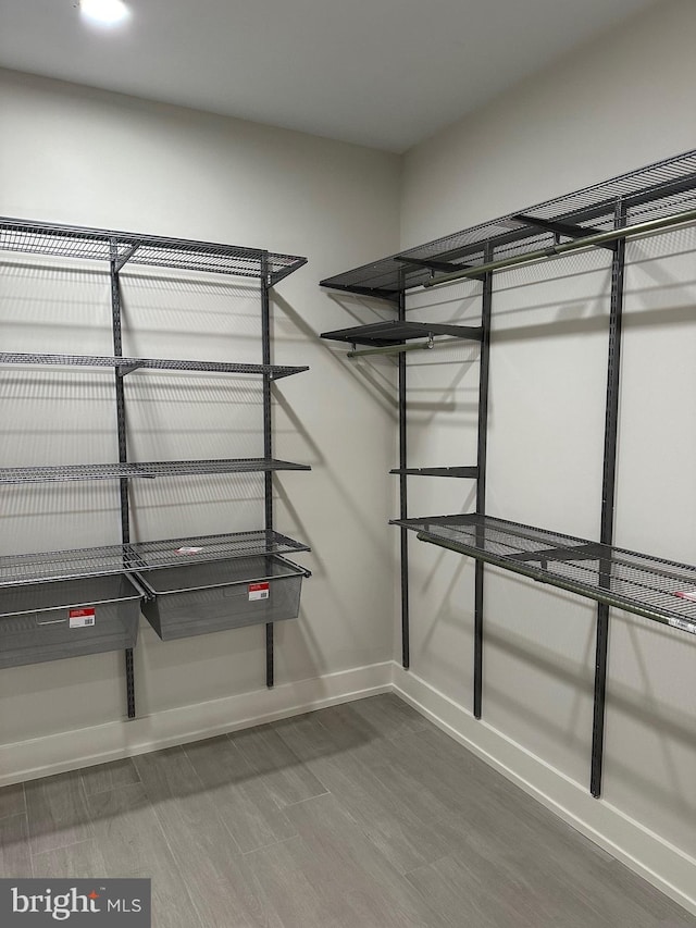 walk in closet featuring hardwood / wood-style floors