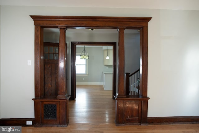 corridor with wood-type flooring