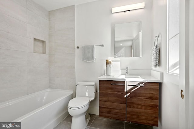 full bathroom featuring tile patterned flooring, vanity, toilet, and tiled shower / bath