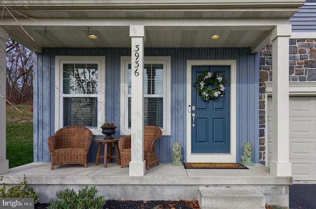 view of exterior entry with covered porch