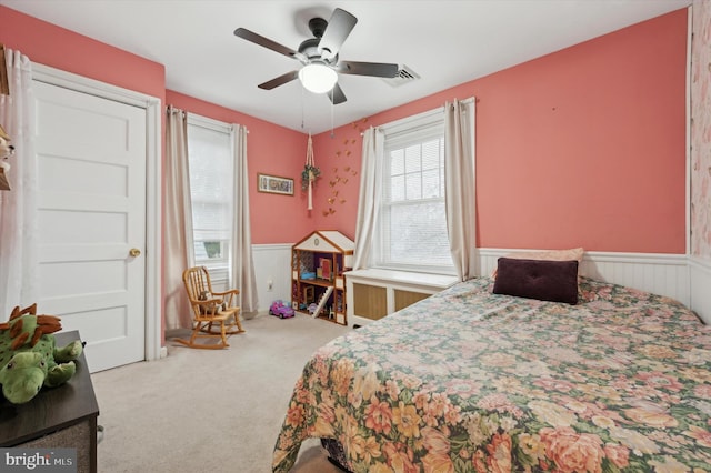 carpeted bedroom featuring ceiling fan