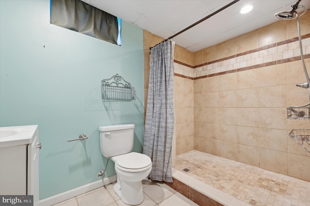 bathroom with a shower with curtain, tile patterned flooring, vanity, and toilet