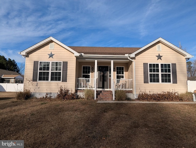 ranch-style house featuring covered porch