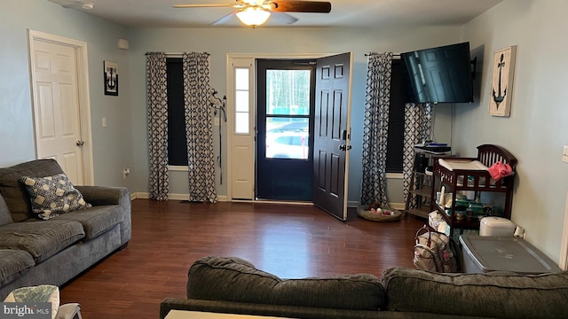 living room with dark hardwood / wood-style floors and ceiling fan