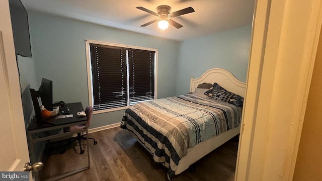 bedroom with ceiling fan and dark wood-type flooring