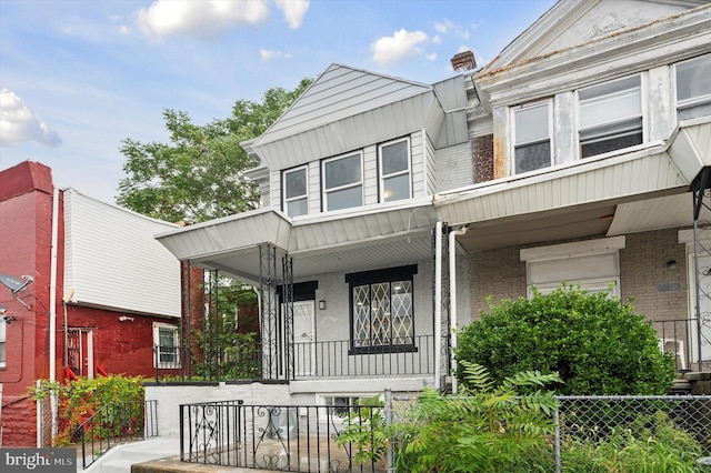 townhome / multi-family property with covered porch