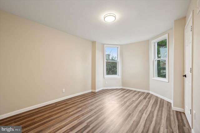 unfurnished room featuring wood-type flooring