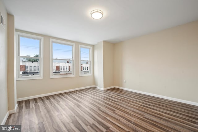 unfurnished room featuring wood-type flooring