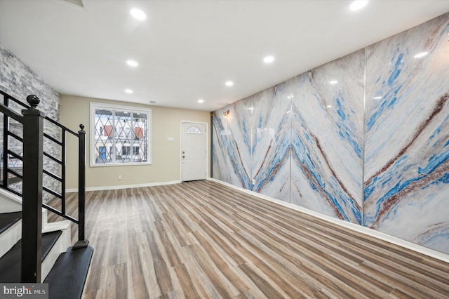 basement with hardwood / wood-style flooring