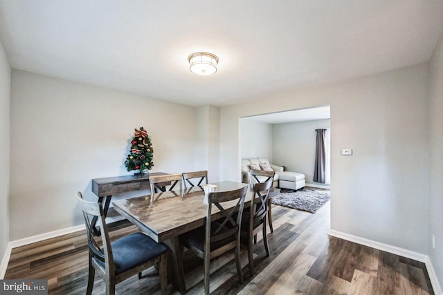 dining room with dark wood-type flooring