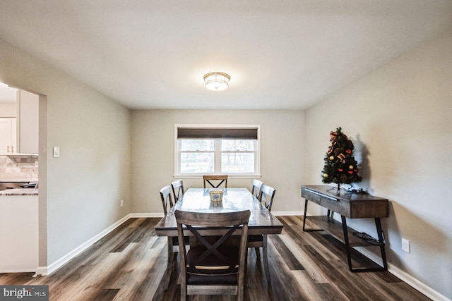 dining space with dark wood-type flooring