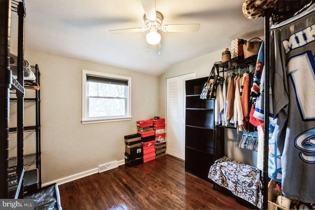 miscellaneous room with ceiling fan, dark wood-type flooring, and vaulted ceiling