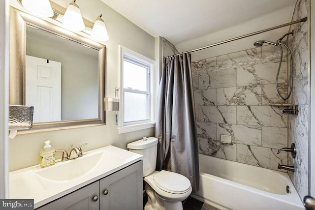 full bathroom featuring shower / bath combo with shower curtain, vanity, and toilet