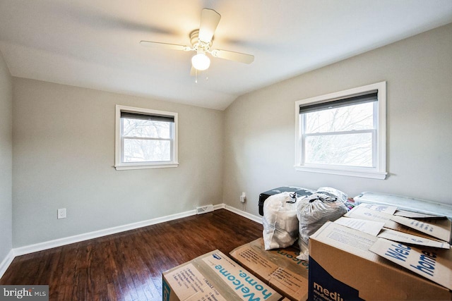 misc room with dark hardwood / wood-style flooring, vaulted ceiling, a wealth of natural light, and ceiling fan