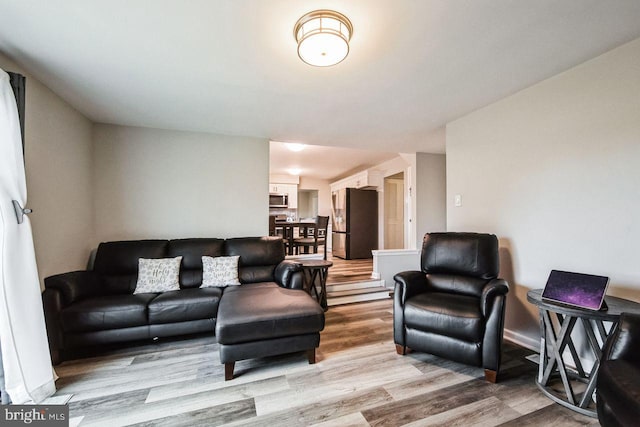 living room with light hardwood / wood-style flooring