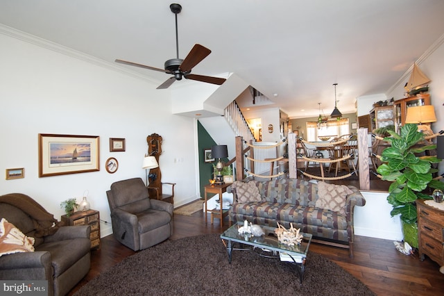 living room featuring ornamental molding, ceiling fan, and dark wood-type flooring