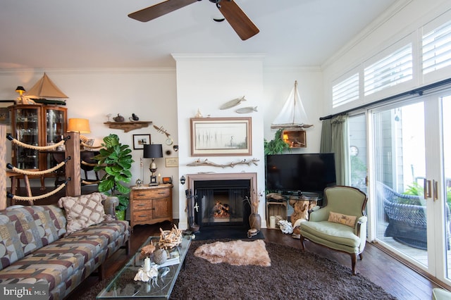 living room featuring crown molding, ceiling fan, and hardwood / wood-style flooring