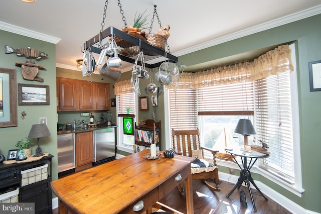 kitchen featuring stainless steel appliances, crown molding, and dark wood-type flooring