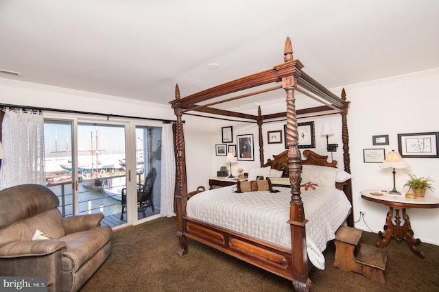 bedroom featuring dark carpet, access to exterior, and crown molding