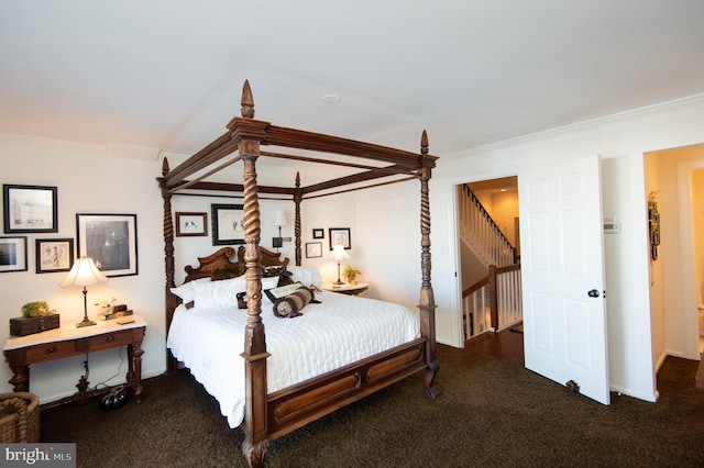 carpeted bedroom with crown molding