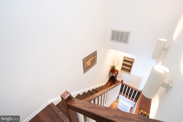 staircase featuring hardwood / wood-style flooring