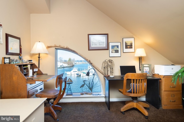 home office featuring dark colored carpet and lofted ceiling