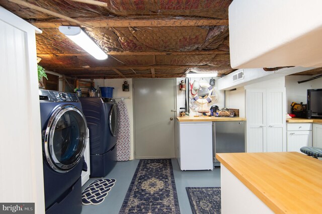 washroom with independent washer and dryer