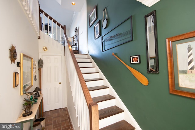 staircase with a high ceiling