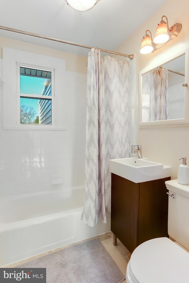 full bathroom with tile patterned floors, vanity, toilet, and shower / tub combo with curtain