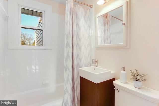 full bathroom with shower / bath combo, toilet, and vanity