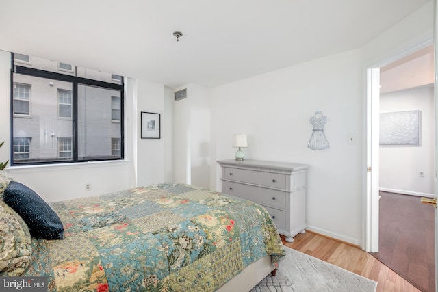 bedroom featuring light hardwood / wood-style floors