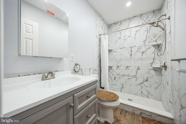 bathroom featuring a shower with shower curtain, vanity, toilet, and hardwood / wood-style floors