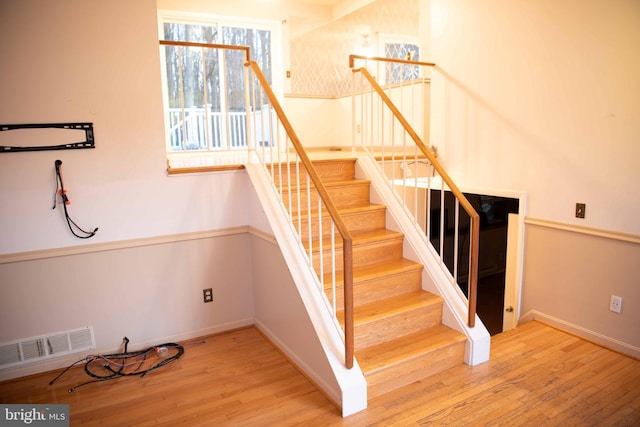 staircase featuring wood-type flooring