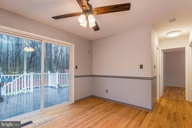 unfurnished room featuring ceiling fan and light hardwood / wood-style floors