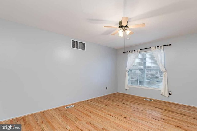 unfurnished room featuring ceiling fan and light hardwood / wood-style flooring