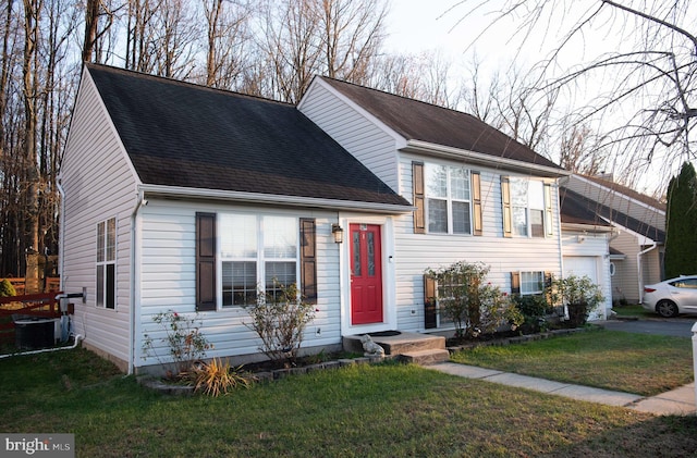 view of front facade with central air condition unit and a front lawn