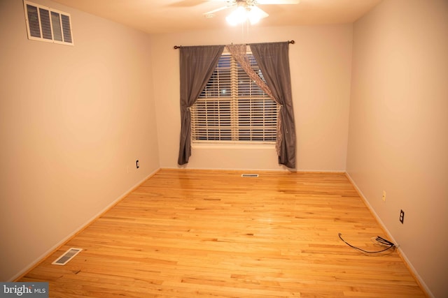 unfurnished room with light wood-type flooring